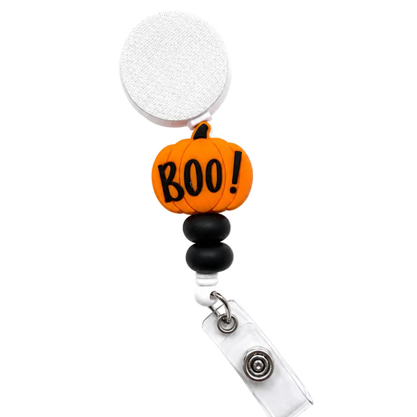 Boo! Pumpkin badge reel featuring an orange pumpkin with the word 