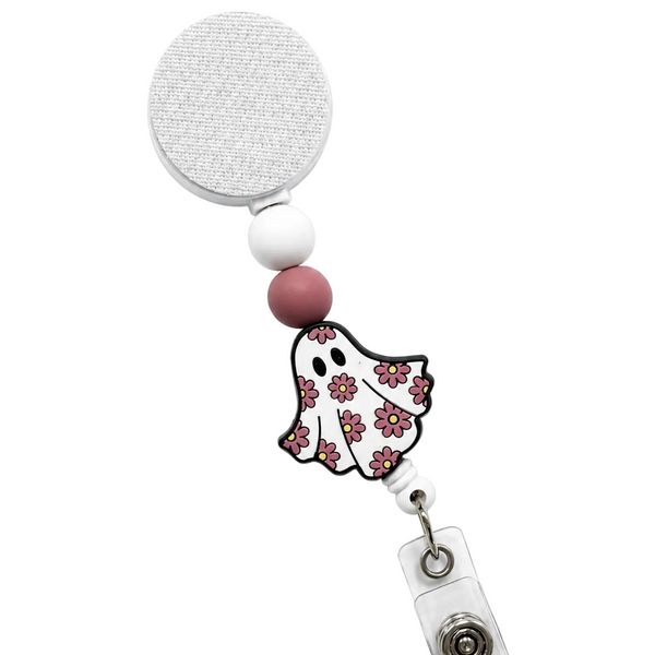 Groovy Ghost badge reel featuring a cute white ghost decorated with pink retro flowers, blush pink and white decorative beads, retractable badge reel, and secure badge holder attachment.