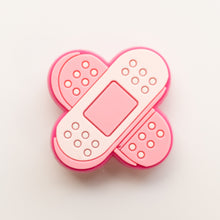 Load image into Gallery viewer, Pink Bandaid Badge Charm - BadgeSmith
