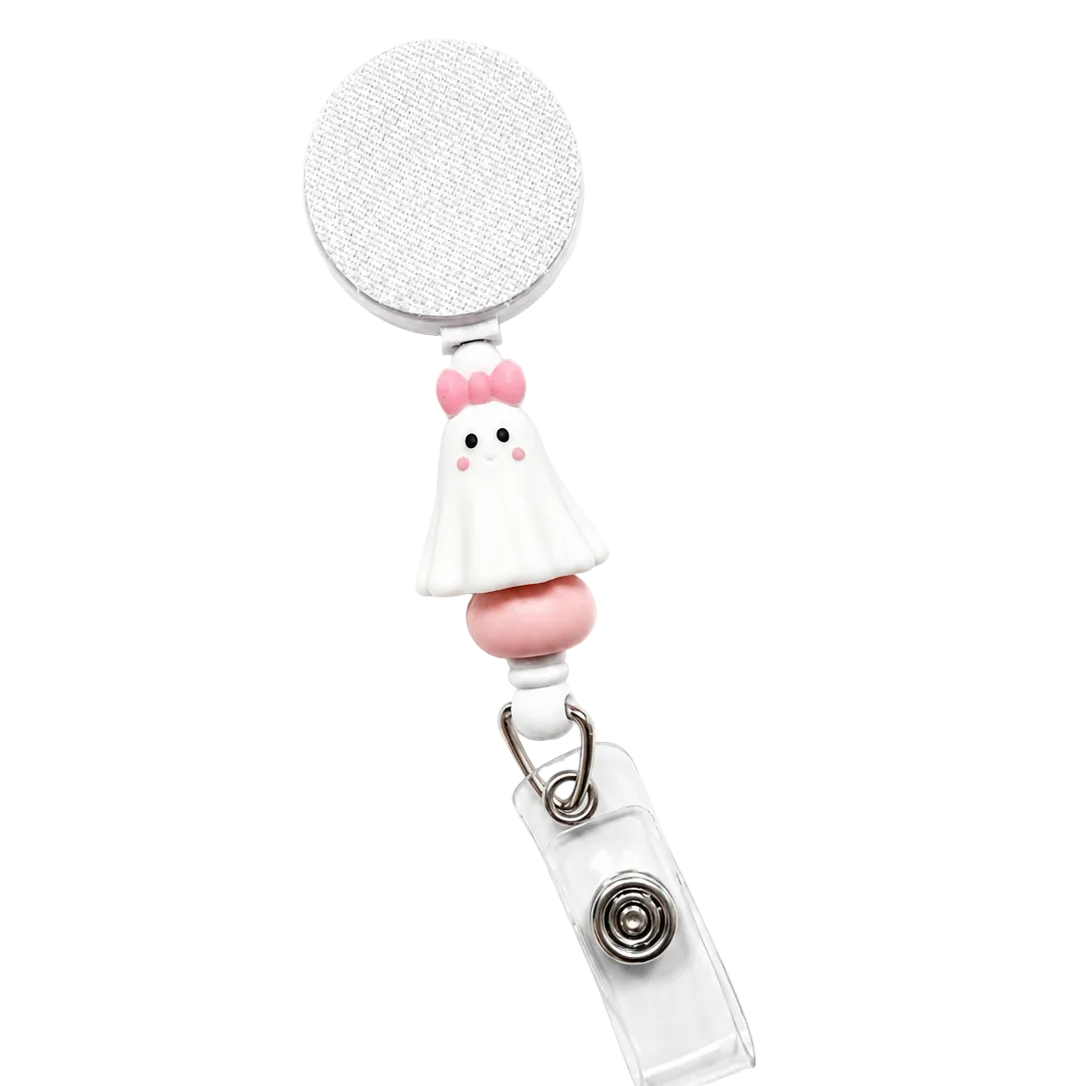 Pink Bow Ghost badge reel featuring a cute white ghost with a pink bow, soft pink and white decorative beads, and a retractable badge reel with secure badge holder attachment.