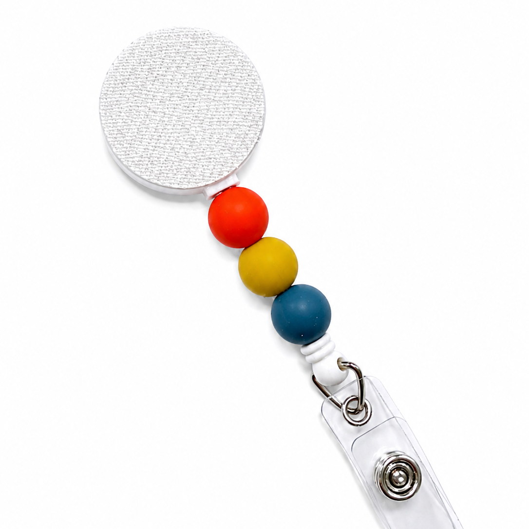 Retro Pop badge reel featuring orange, mustard yellow, and deep teal decorative beads with a retractable badge reel design and secure badge holder attachment.