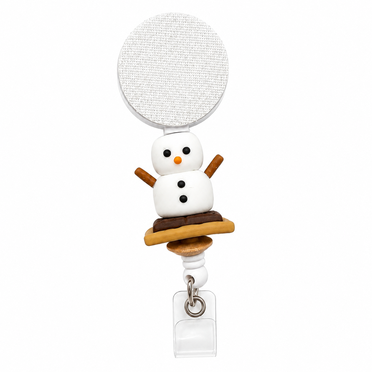 S'mores badge reel featuring a smiling marshmallow character sitting on a chocolate and graham cracker s'more with a retractable badge reel and secure badge holder attachment.